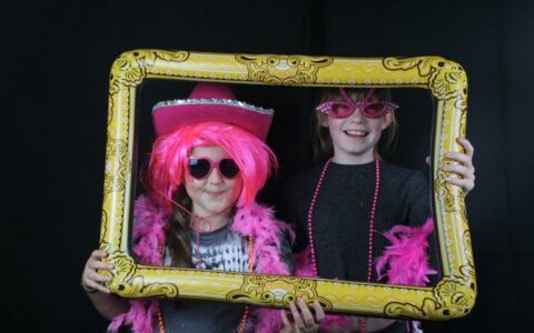 Two children in dressed in photo props