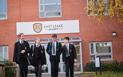 Male and female students walking