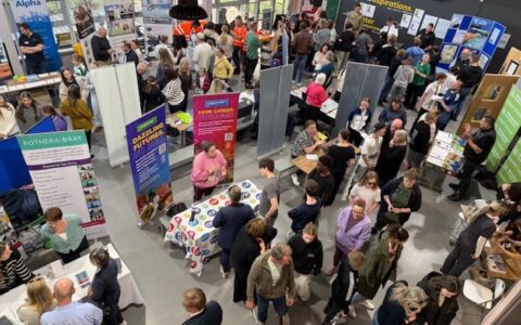 Students and exhibitors in a hall at East Leake Academy’s Careers Fair