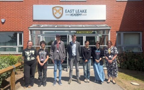 Sixth form students with local MP outside of East Leake Academy