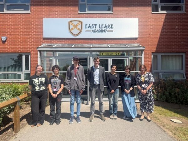 Sixth form students with local MP outside of East Leake Academy